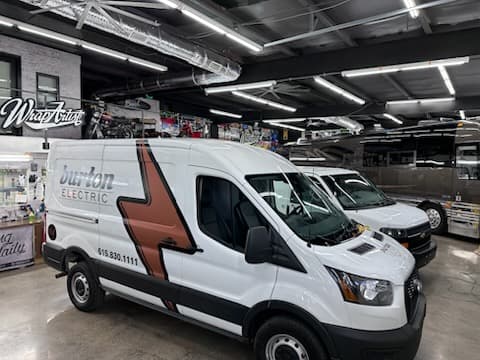 image of 2 burton electrical vans on a jobsite